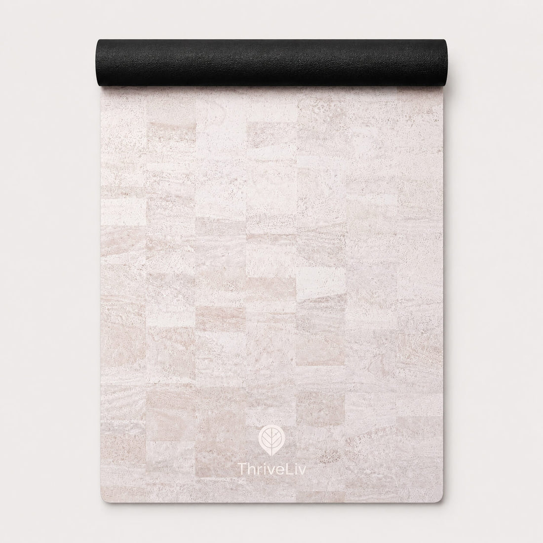 A rolled-up yoga mat with a light beige and off-white stone tile pattern, featuring the ThriveLiv logo at the bottom, set against a clean off-white background.