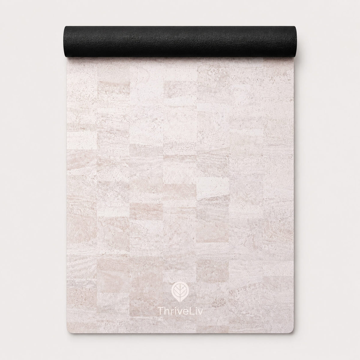 A rolled-up yoga mat with a light beige and off-white stone tile pattern, featuring the ThriveLiv logo at the bottom, set against a clean off-white background.