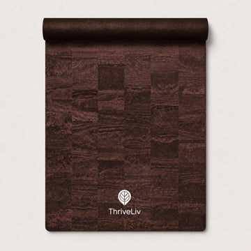 A rolled-up dark brown textured mat or rug with a patchwork wood-grain pattern, featuring the white ThriveLiv logo near the bottom, set against a light gray background.