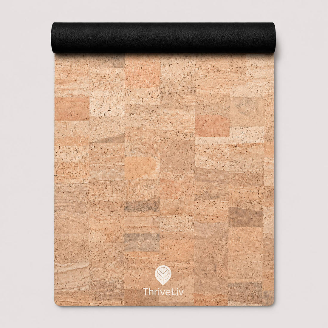 A cork mat with a natural cork patchwork pattern in shades of beige, tan, and brown, featuring a black rolled edge at the top and a white ThriveLiv logo at the bottom.