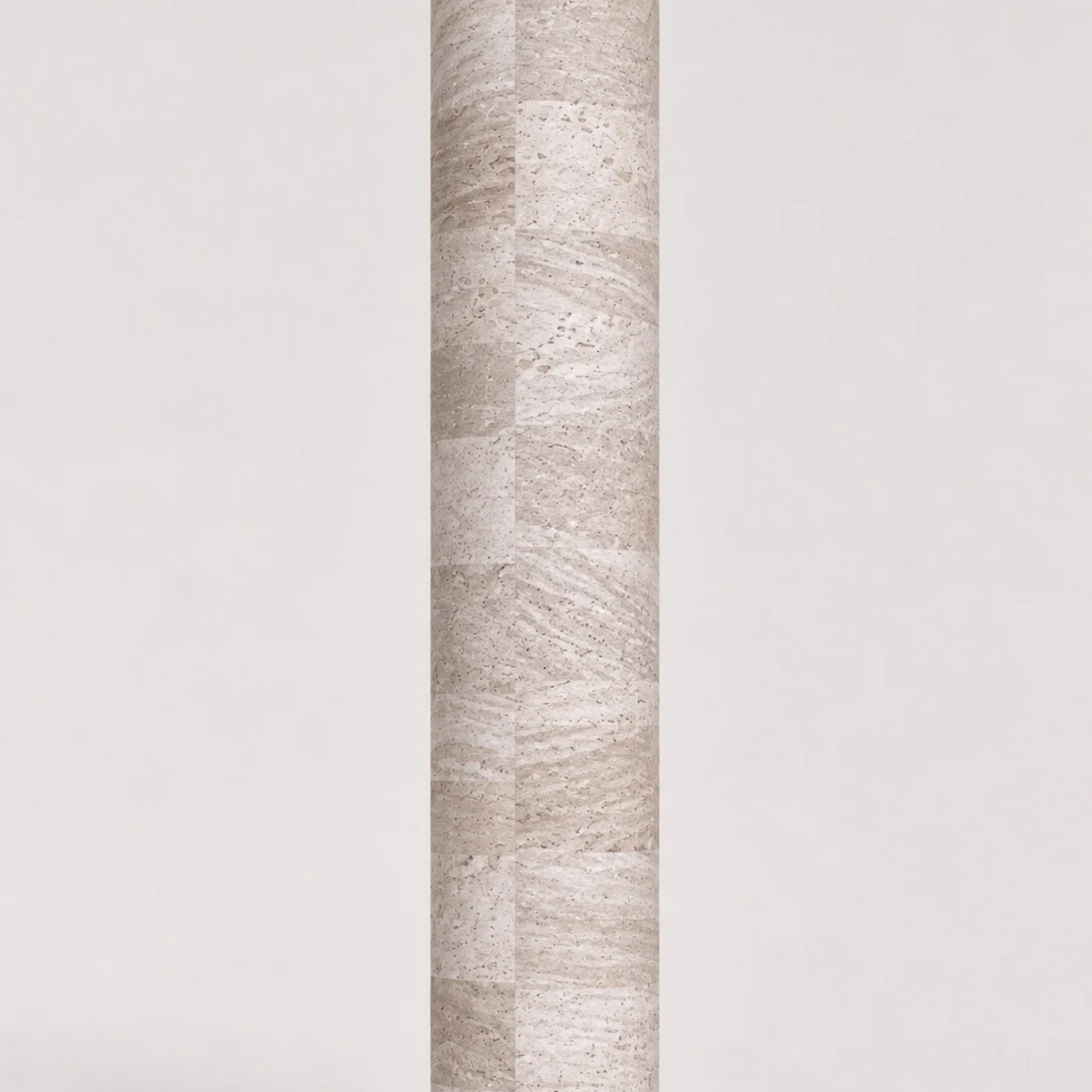 Rolled ThriveLiv natural cork yoga mat standing upright against a soft off-white studio background, showing the light neutral cork pattern and texture.