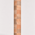 Rolled ThriveLiv natural cork yoga mat standing upright against a soft off-white studio background, showing the neutral cork pattern and texture.