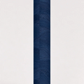 Rolled ThriveLiv natural cork yoga mat standing upright against a soft off-white studio background, showing the blue cork pattern and texture.