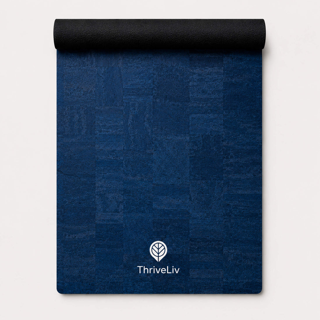 Rolled up blue yoga mat made from cork material