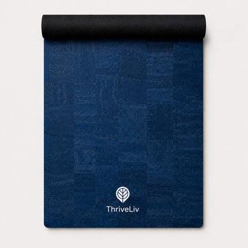 Rolled up blue yoga mat made from cork material