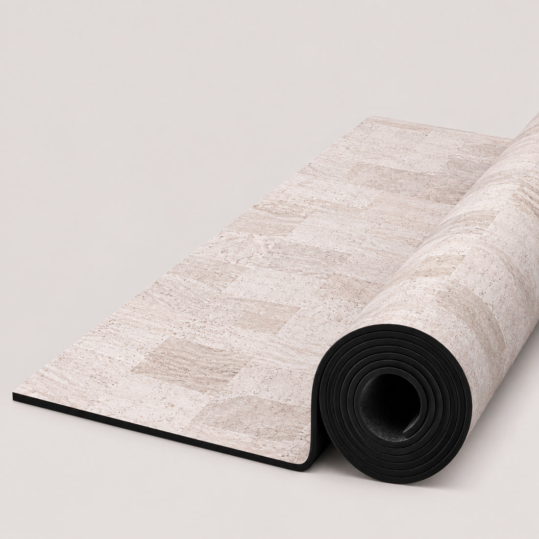 A rolled-up yoga mat with a light beige and off-white stone tile pattern, featuring the ThriveLiv logo at the bottom, set against a clean off-white background.