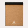 A rolled-up sand coloured yoga mat, showing the black reverse grip, shown on a clean white background. The ThriveLiv logo is printed near the bottom.